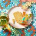 lola-white-oilcloth-Flowers-orange-blue